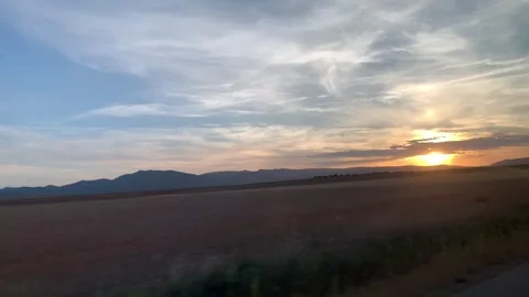 Driving Away From the Sunset Stock Footage 253432549