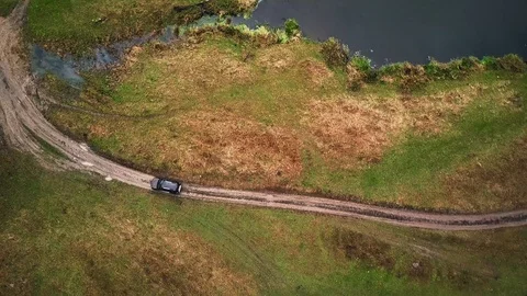 Driving on a bad road with a big puddle. 스톡 동영상 105200678