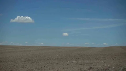 DRIVING BY BAREN FARM FIELDS SLOW MOTION Video stock 81008373