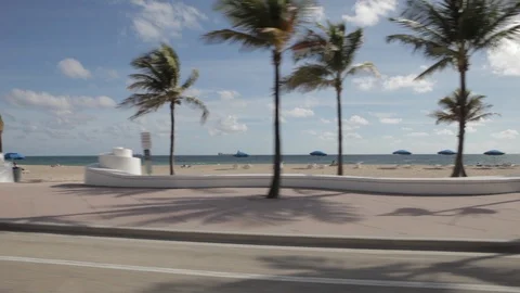 Driving By a Beach On a Sunny Day Stock Footage 102129073