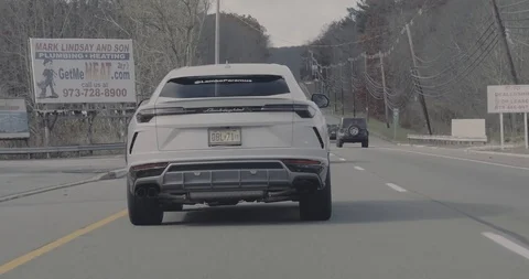 Driving behind Lamborghini Urus Stock Footage 105121891
