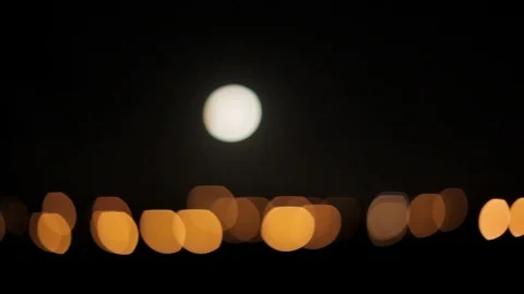 Driving Beside a Full Moon Over Distant City Lights HD Video Vídeo Stock 89811629
