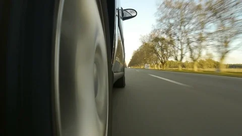 Driving a black sports / super car on a country road. UK Stock Footage