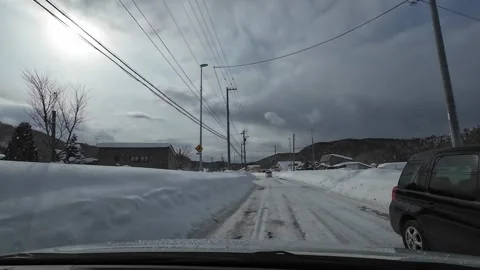 Driving in blowing snow snow drift winter road Sapporo Japan Video stock 333204902
