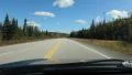 Driving with blue sky and fluffy white clouds. Northern Ontario, Canada. HD Footage