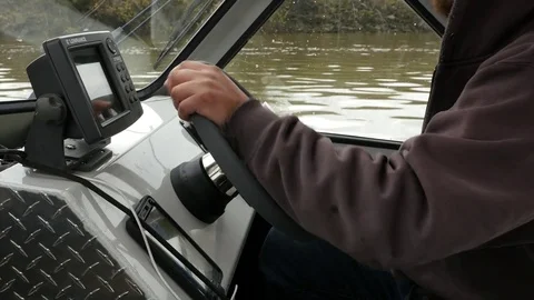 Driving boat on the river. Hands on steering wheel. 스톡 동영상 74713386