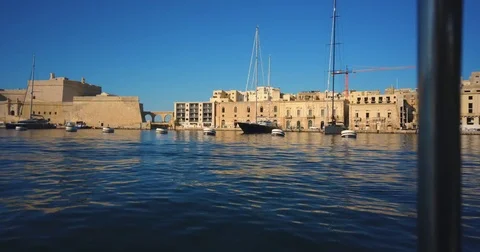 Driving with a Boat through Harbour of Valetta Malta 4k Video Stock Footage 79976849