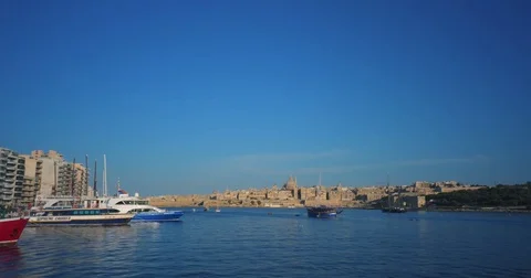 Driving with a Boat through Harbour of Valetta Malta 4k Video Stock Footage 79979610