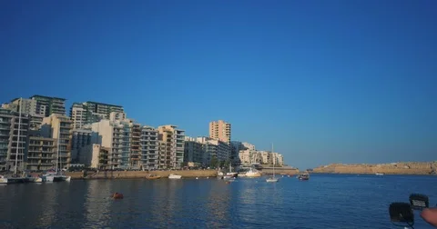 Driving with a Boat through Harbour of Valetta Malta 4k Video Stock Footage 79979695