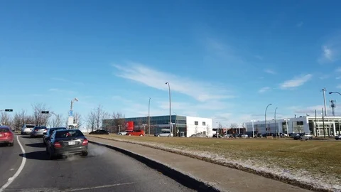 Driving on boulevard Des Sources during sunny winter day in Montreal, Canada Stock Footage 105472544