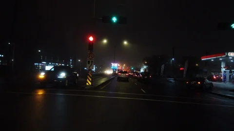 Driving on boulevard St-Jean during a foggy winter night in Montreal, Canada Stock Footage 105466529