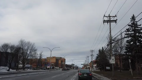 Driving on boulevard St-Jean during cloudy winter day in Montreal, Canada Stock Footage 105472409