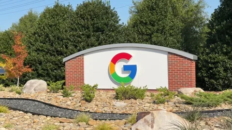 Driving By A Brick Sign With Google Logo And Garden At A Data Center In Stock Footage 328088318
