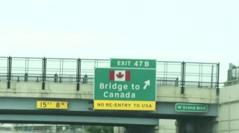 Driving by Bridge to Canada sign Video stock 52217681