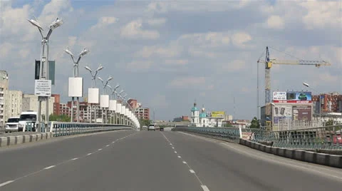 Driving on the bridge named after the sixtieth anniversary of victory. omsk. Stock Footage 24469527