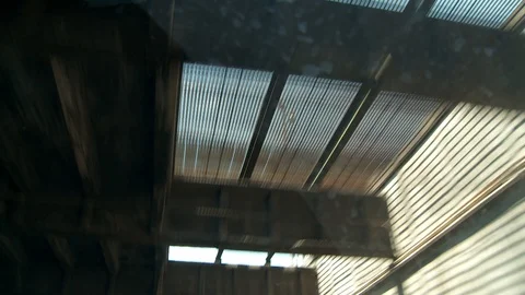 Driving on bridge overpass with view of cement trestle above, day. Vídeo Stock 107211642