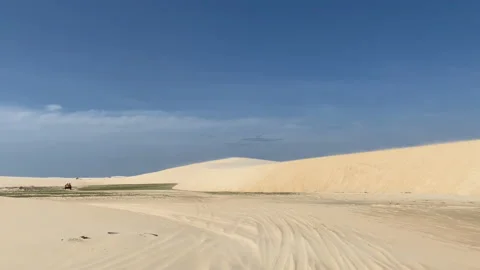 Driving a buggy through the sandy dunes Видео 176162247