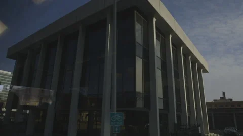 Driving by Buildings on Street Stock Footage 148750153