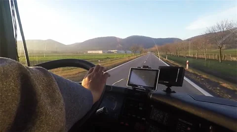 Driving bus or truck nahds hold steering wheel with gps navigator inside cabin Stock Footage