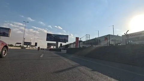 Driving the Cairo Ring Road Loop Surrounded by the Endless Expansion of the City Stock Footage 330073250