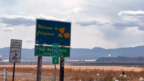 Driving into California from Nevada on Interstate 15 and passing the Stock Footage 176246678