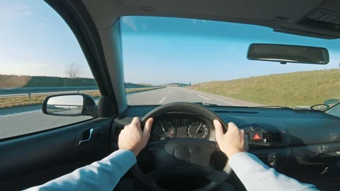 Driving car on almost empty freeway while the sun shines Stock Footage 98678542