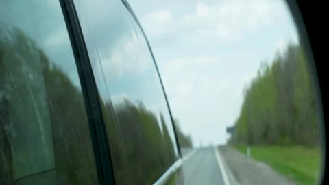 Driving car and looking at rear view mirror Stock-Footage 240839677