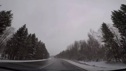 Driving a car in bad winter weather Stock Footage