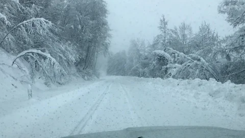Driving in the car in a blizzard Stock Footage 97871791