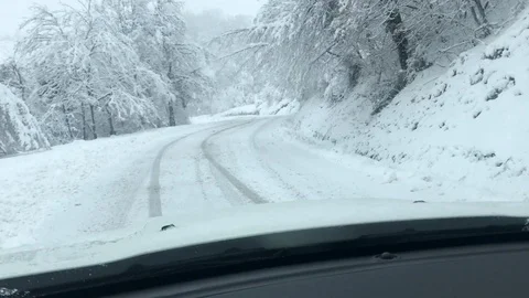 Driving in the car in a blizzard Stock Footage 97872249
