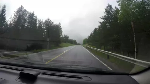 Driving a car on a cloudy and rainy day Stock Footage 53889405