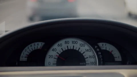 Driving car dashboard with speedometer in traffic Stock Footage 328560853