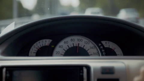 Driving car dashboard with speedometer in traffic Stock Footage 328560912