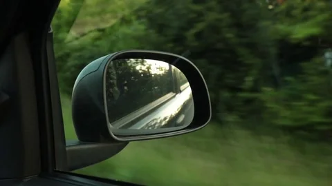 Driving a car during sunset 動画素材 76798127