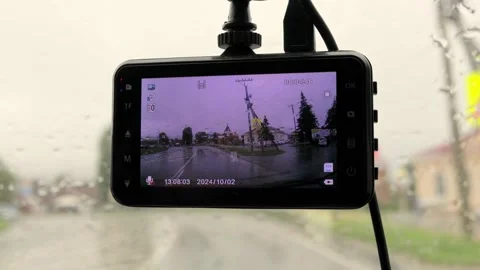 Driving in a car with a DVR through the village in rainy weather 4k video 스톡 동영상 303413073