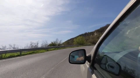 Driving a car on an empty asphalt road through the countryside, POV shot Stock Footage 333560592