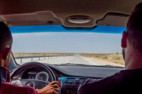 Driving in a car on empty high way Stock Photos