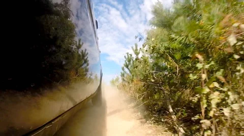 Driving a car in the field, a car pick up dust. Stock Footage 42537312