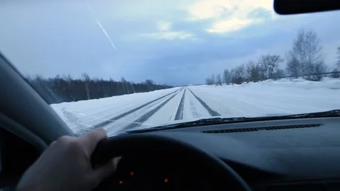 Driving a car in the first person, winter road Stock Footage