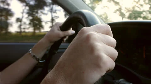 Driving a car on the freeway. Hands on the steering wheel. Stock Footage 23439383