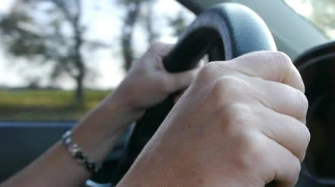 Driving a car on the freeway. Hands on the steering wheel. Stock Footage 23441274
