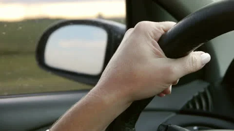 Driving a car on the freeway. Hands on the steering wheel. Stock Footage 23447082