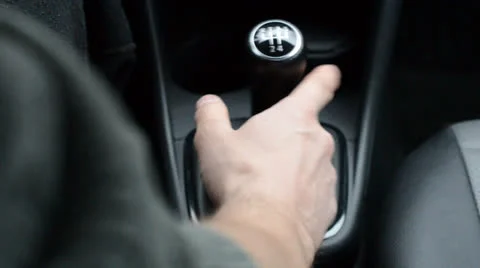 Driving a car, with hand on the gearshift knob Video stock 22793342