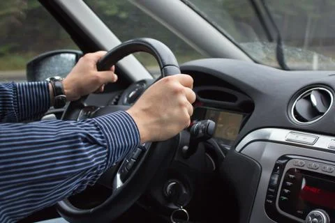 Driving a Car - Hands on Steering Wheel Stock Photos