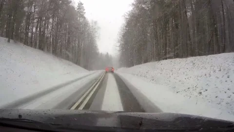 Driving a car in heavy snow Stock Footage 71302655