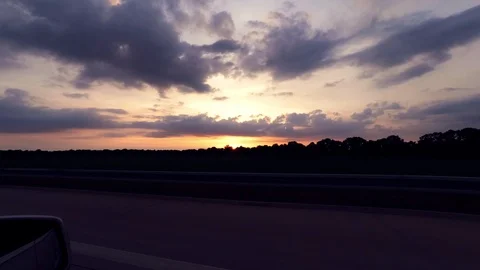 Driving with car on highway during sunset, driver view to the side Stock Footage 111947862