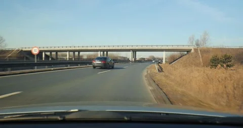 Driving a car on a highway Stock Footage 142486992
