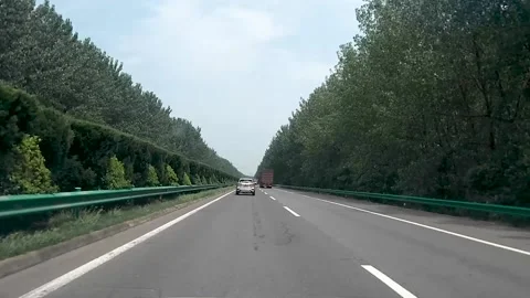 Driving a car on the highway Stock Footage 153657689