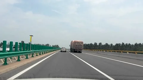 Driving a car on the highway Stock Footage 153657712