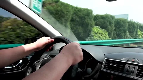 Driving a car on the highway Stock Footage 153658392